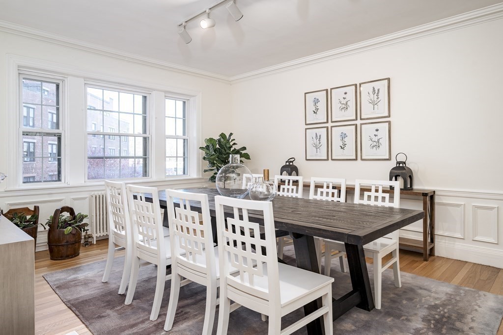 986 Memorial Drive, Unit 404 Cambridge, MA 02138 - Photo 12 of 41 a view of a dining room with furniture and window