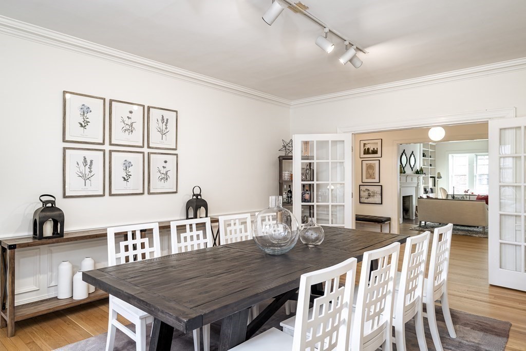 986 Memorial Drive, Unit 404 Cambridge, MA 02138 - Photo 13 of 41 a view of a dining room with furniture and wooden floor