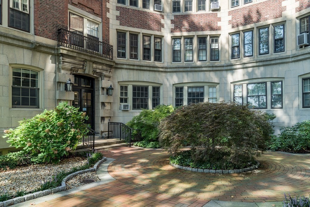 986 Memorial Drive, Unit 404 Cambridge, MA 02138 - Photo 32 of 41 a front view of a multi story residential apartment building