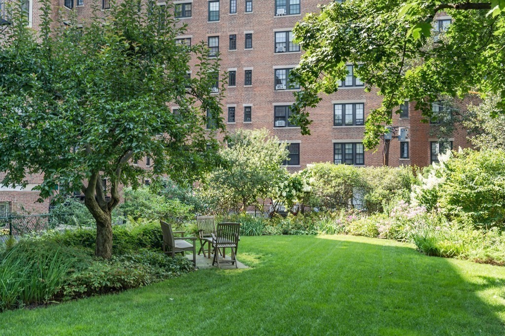 986 Memorial Drive, Unit 404 Cambridge, MA 02138 - Photo 37 of 41 a view of a house with a yard and sitting area