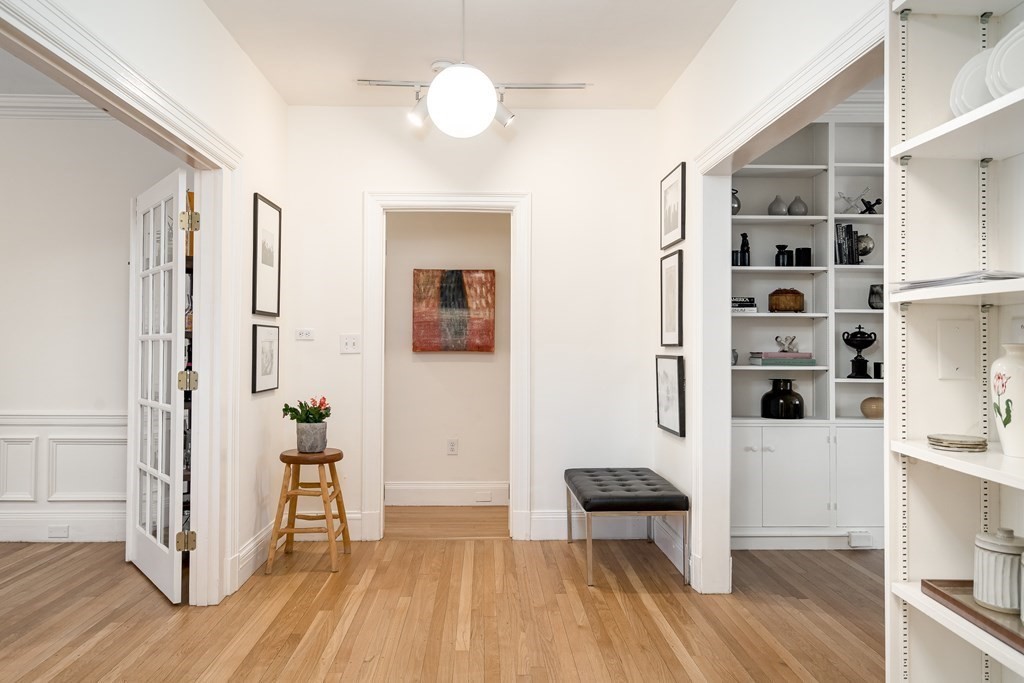 986 Memorial Drive, Unit 404 Cambridge, MA 02138 - Photo 4 of 41 wooden floor in an empty room with a window