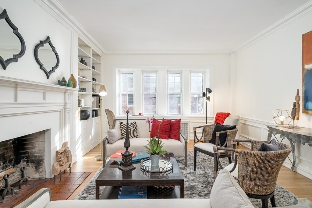 986 Memorial Drive, Unit 404 Cambridge, MA 02138 - Photo 5 of 41 a living room with furniture and a fireplace