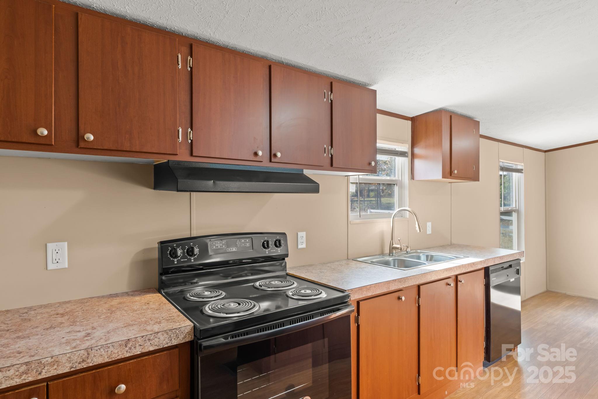 1080 Beckham Road Salisbury, NC 28147 - Photo 12 of 30 a kitchen with granite countertop a sink stove and cabinets