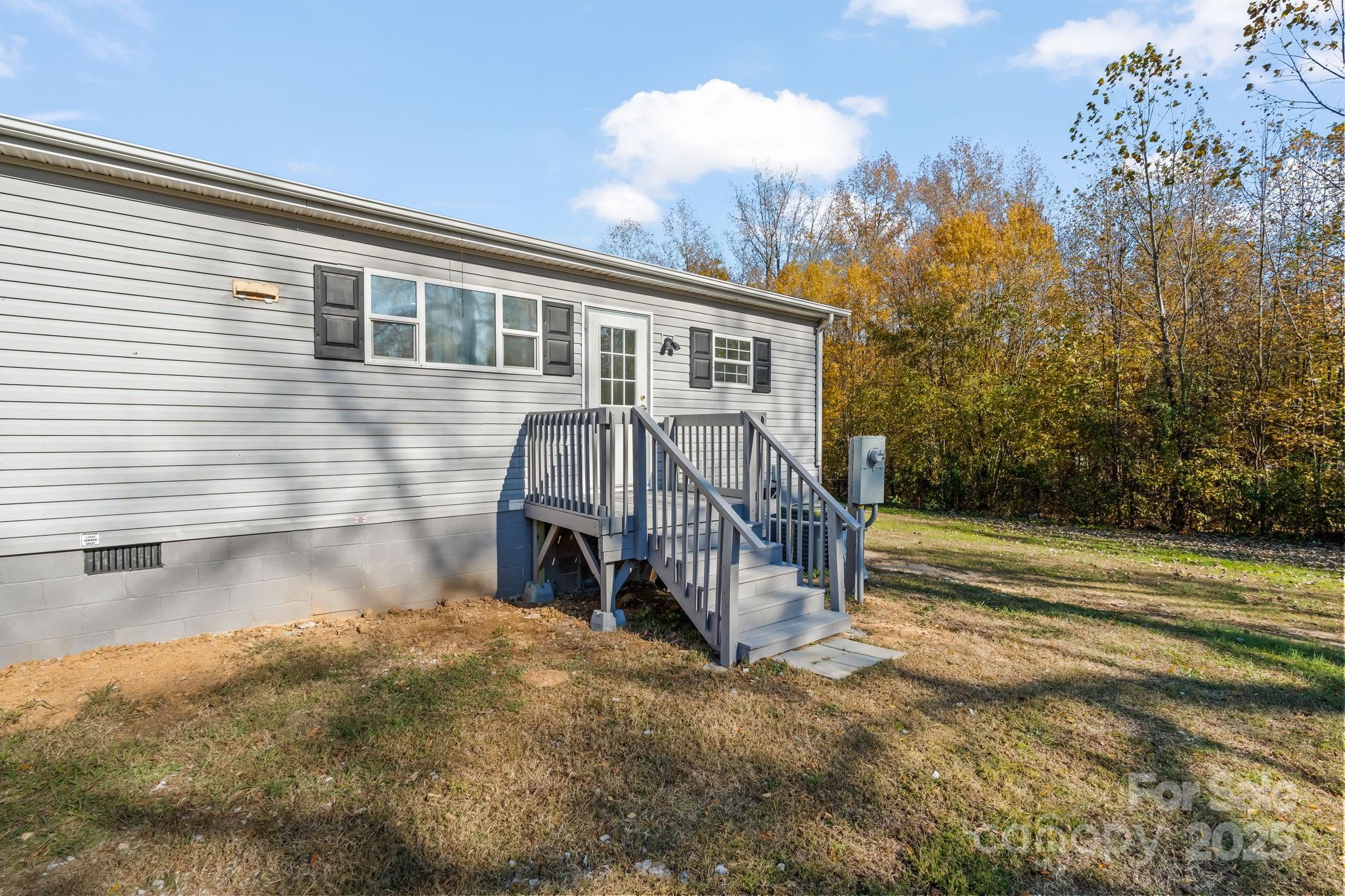 1080 Beckham Road Salisbury, NC 28147 - Photo 2 of 30 a view of a house with a yard and sitting area