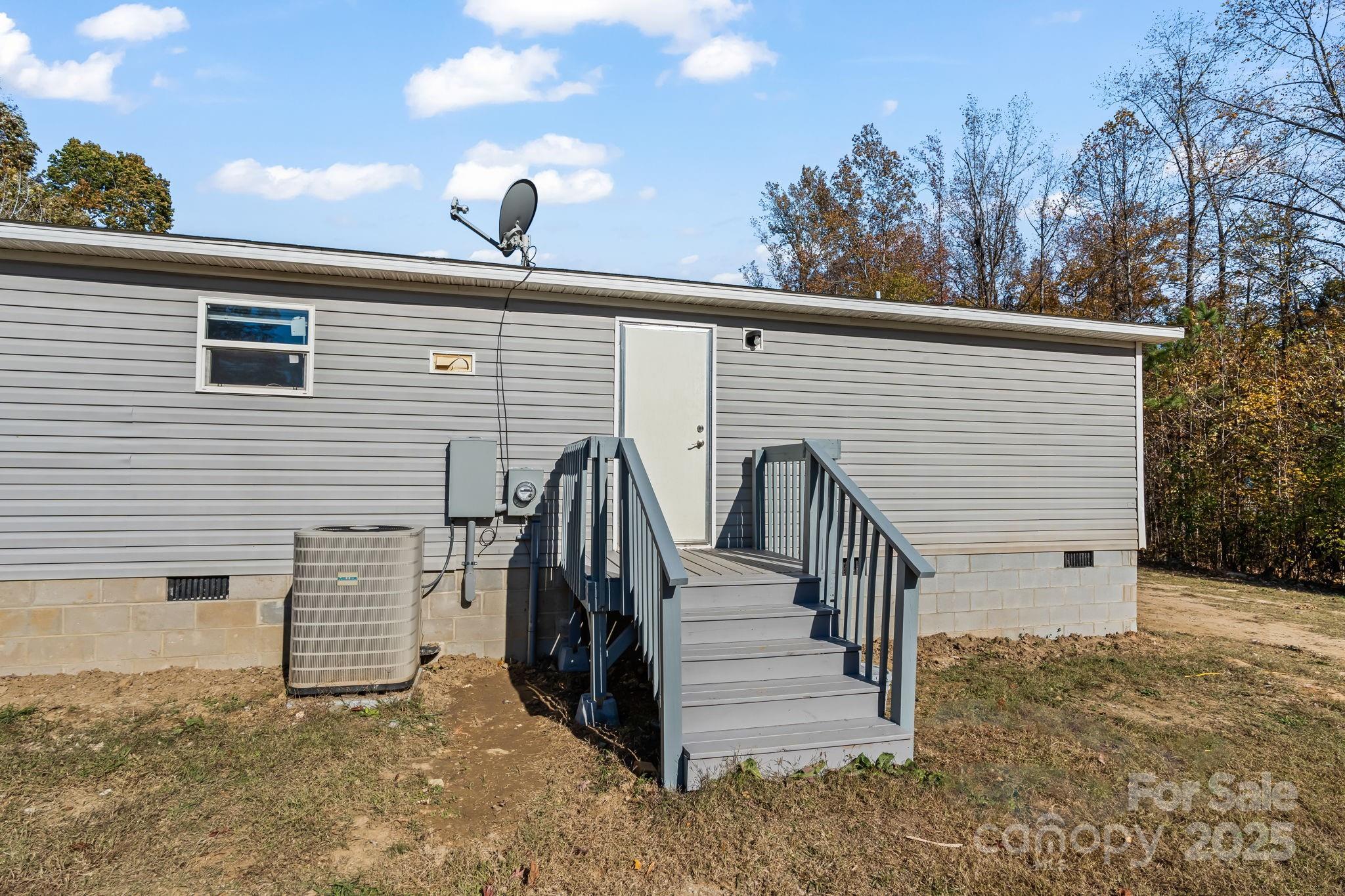 1080 Beckham Road Salisbury, NC 28147 - Photo 28 of 30 a view of a house with backyard and trees