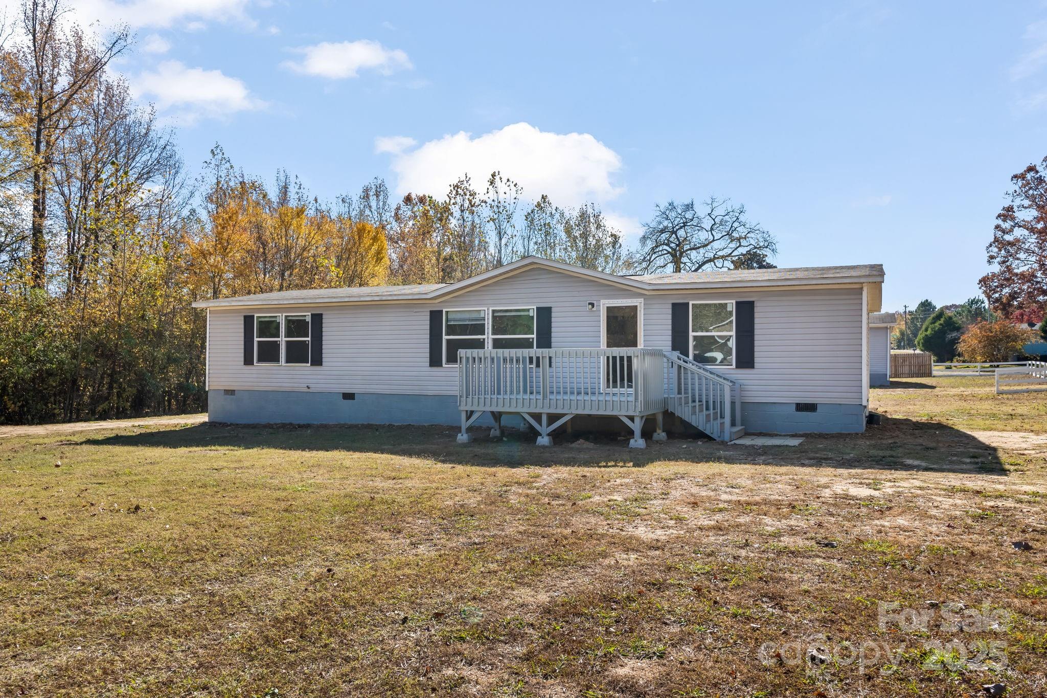 1080 Beckham Road Salisbury, NC 28147 - Photo 3 of 30 a house view with a garden space
