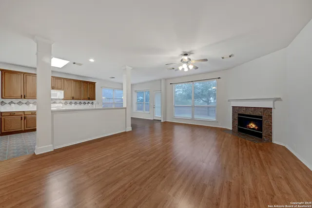 a view of a kitchen with a sink and a stove top oven