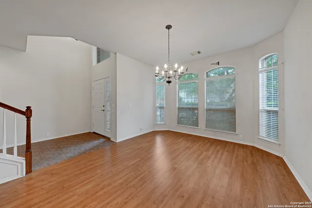 a view of an empty room with windows