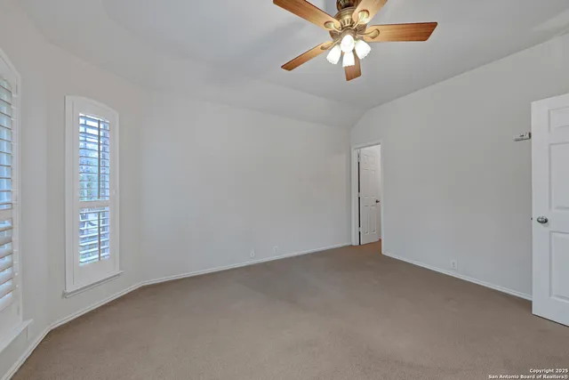 a view of an entryway with wooden floor and door