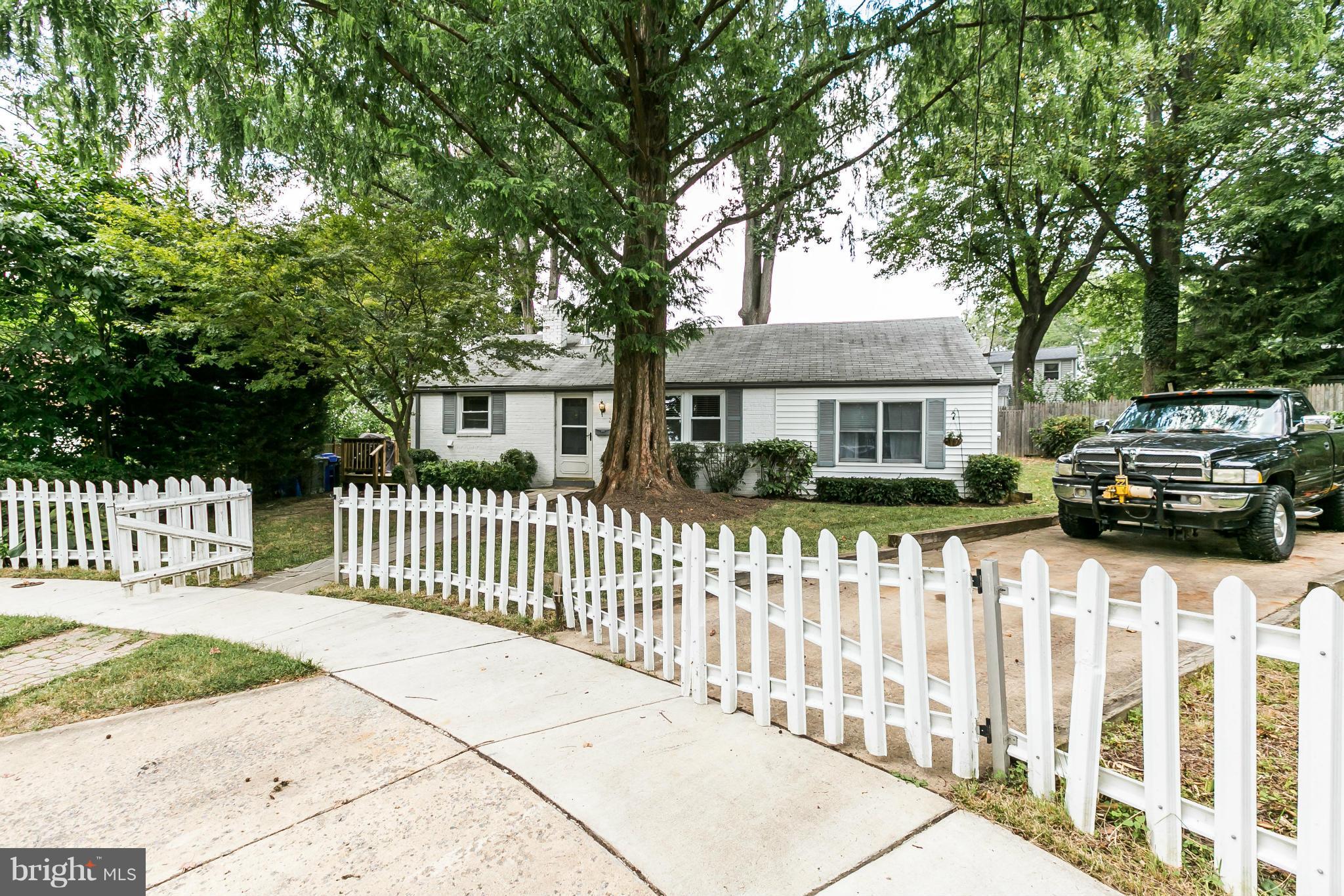 2907 Weisman Road Silver Spring, MD 20902 - Photo 2 of 30 a front view of a house with a garden