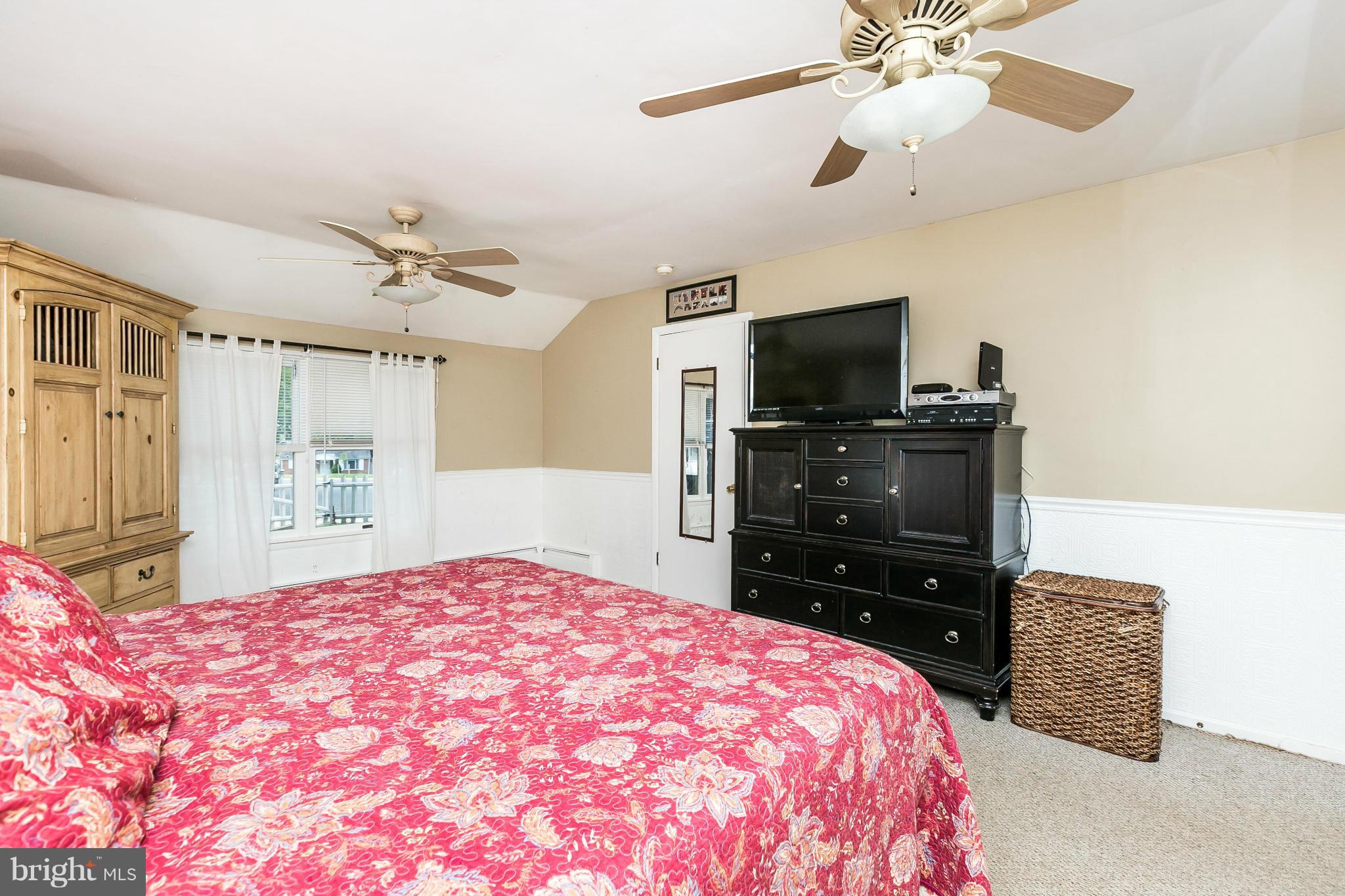 2907 Weisman Road Silver Spring, MD 20902 - Photo 14 of 30 a bedroom with a bed and a flat screen tv