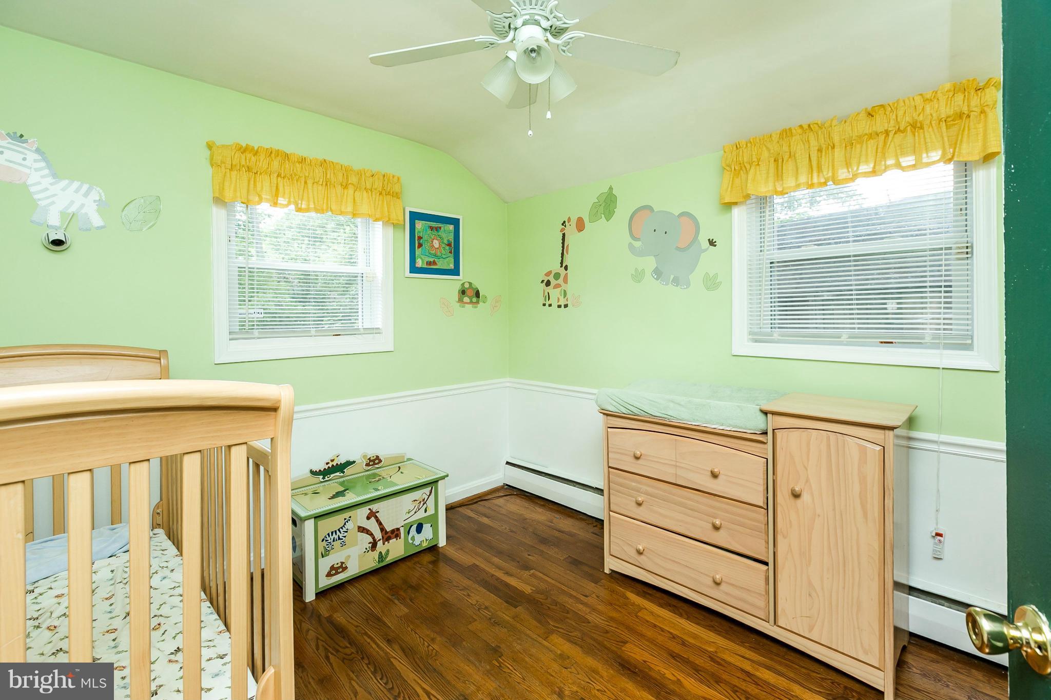 2907 Weisman Road Silver Spring, MD 20902 - Photo 20 of 30 a hallway with a dresser and a window