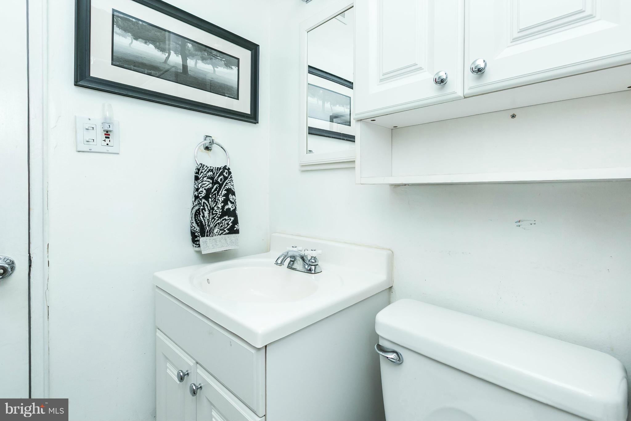 2907 Weisman Road Silver Spring, MD 20902 - Photo 23 of 30 a bathroom with a sink and a toilet