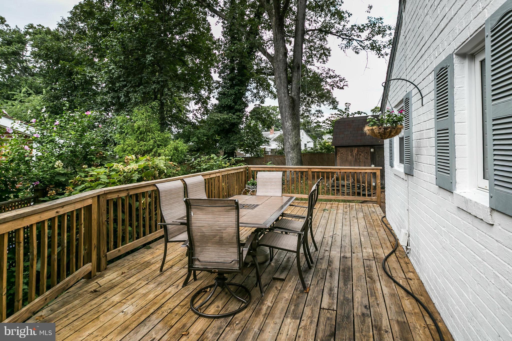 2907 Weisman Road Silver Spring, MD 20902 - Photo 25 of 30 a view of balcony with wooden floor and outdoor seating