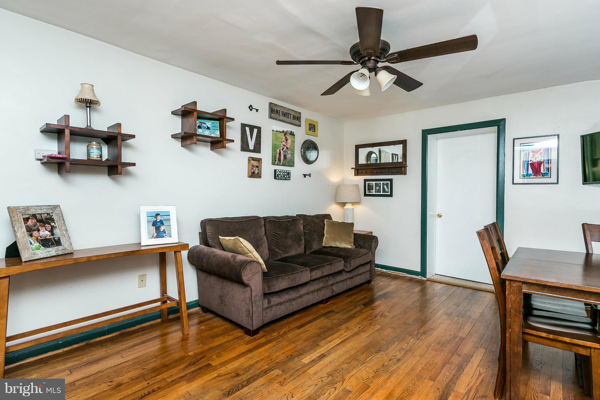 2907 Weisman Road Silver Spring, MD 20902 - Photo 4 of 30 a living room with furniture and a wooden floor