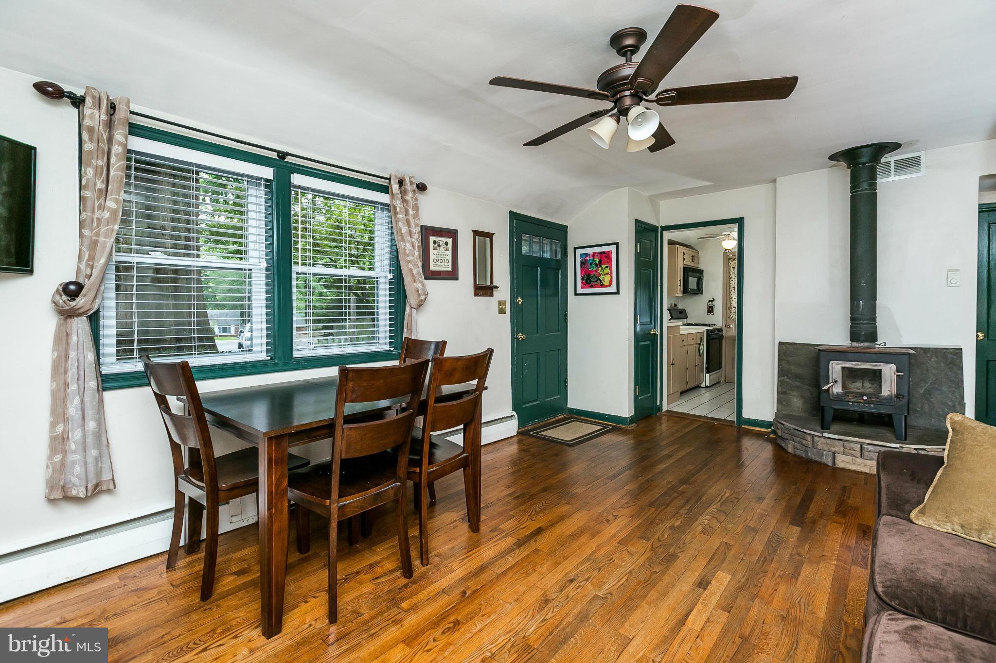 2907 Weisman Road Silver Spring, MD 20902 - Photo 6 of 30 a view of a dining room with furniture window and wooden floor
