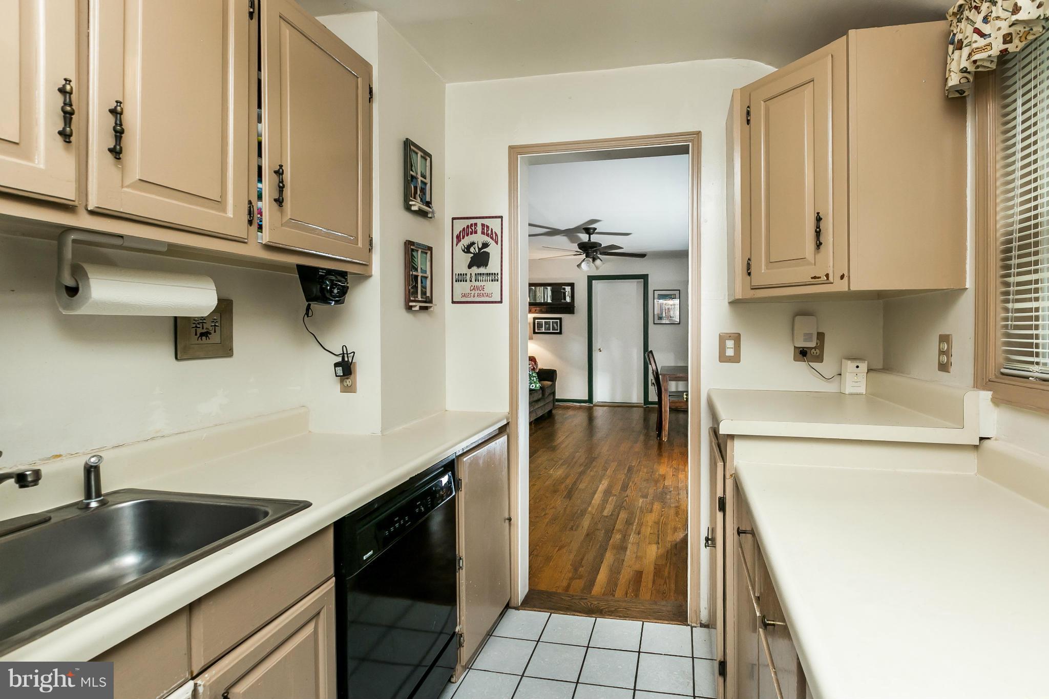 2907 Weisman Road Silver Spring, MD 20902 - Photo 10 of 30 a kitchen with a sink and cabinets