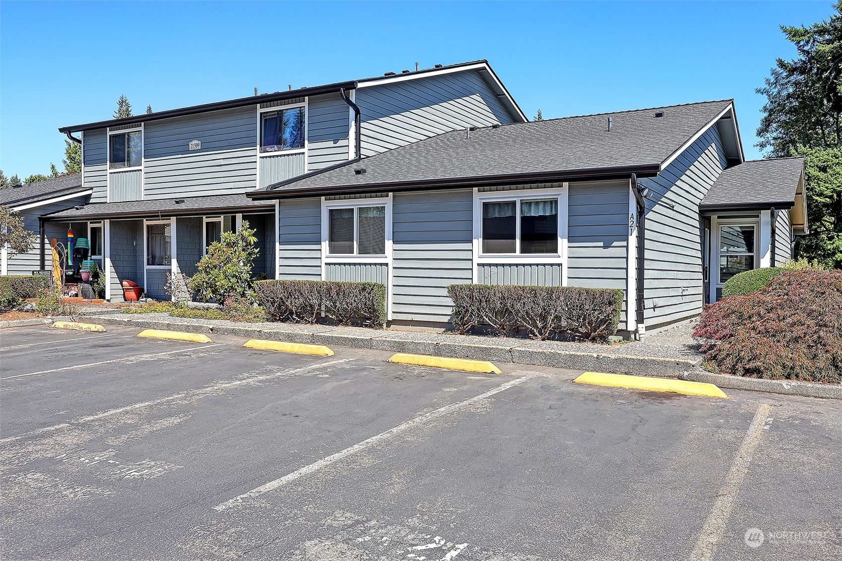 a view of a house with swimming pool and a yard