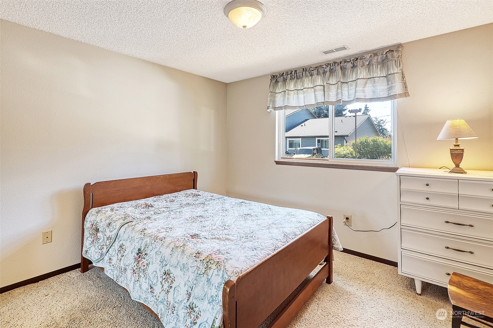 21509 4th Avenue West, Unit A21 Bothell, WA 98021 - Photo 13 of 17 a bedroom with a bed and cabinet