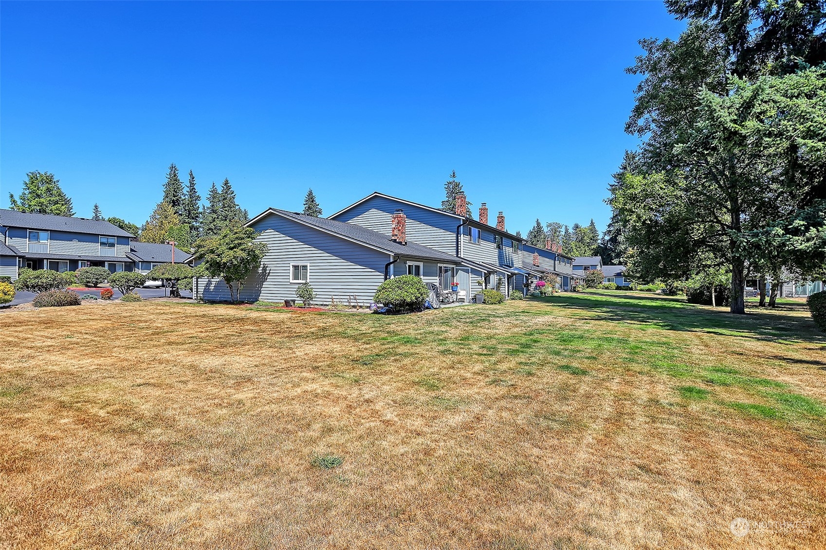 21509 4th Avenue West, Unit A21 Bothell, WA 98021 - Photo 15 of 17 a view of a house with a yard