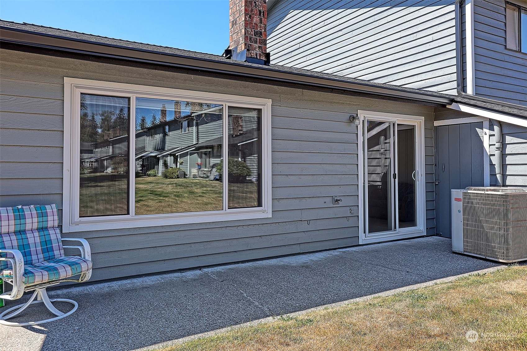 21509 4th Avenue West, Unit A21 Bothell, WA 98021 - Photo 16 of 17 a front view of a house with a yard