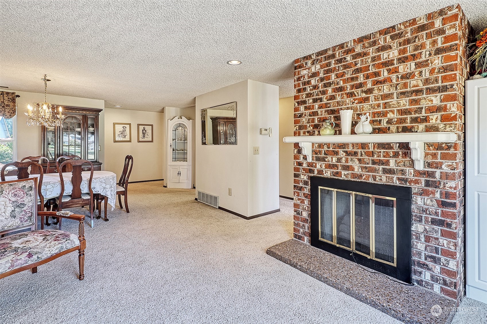 21509 4th Avenue West, Unit A21 Bothell, WA 98021 - Photo 3 of 17 a living room with furniture and a fireplace
