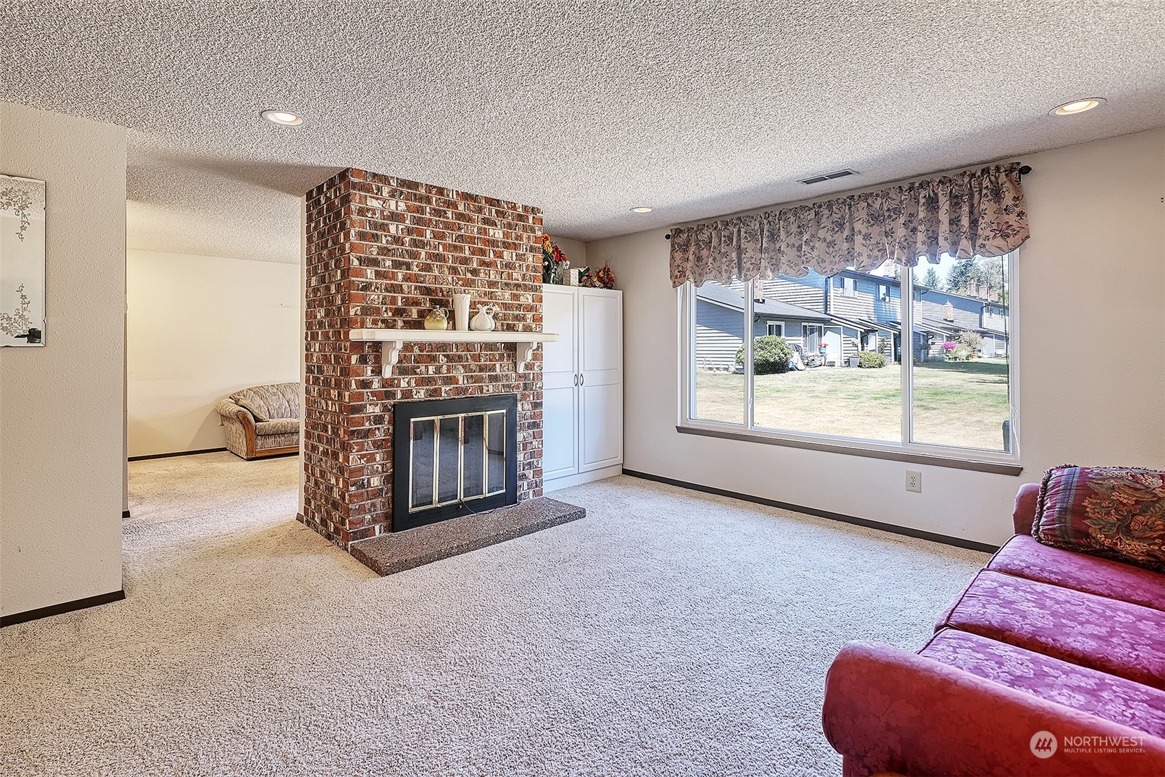 21509 4th Avenue West, Unit A21 Bothell, WA 98021 - Photo 4 of 17 a view of livingroom with furniture and windows