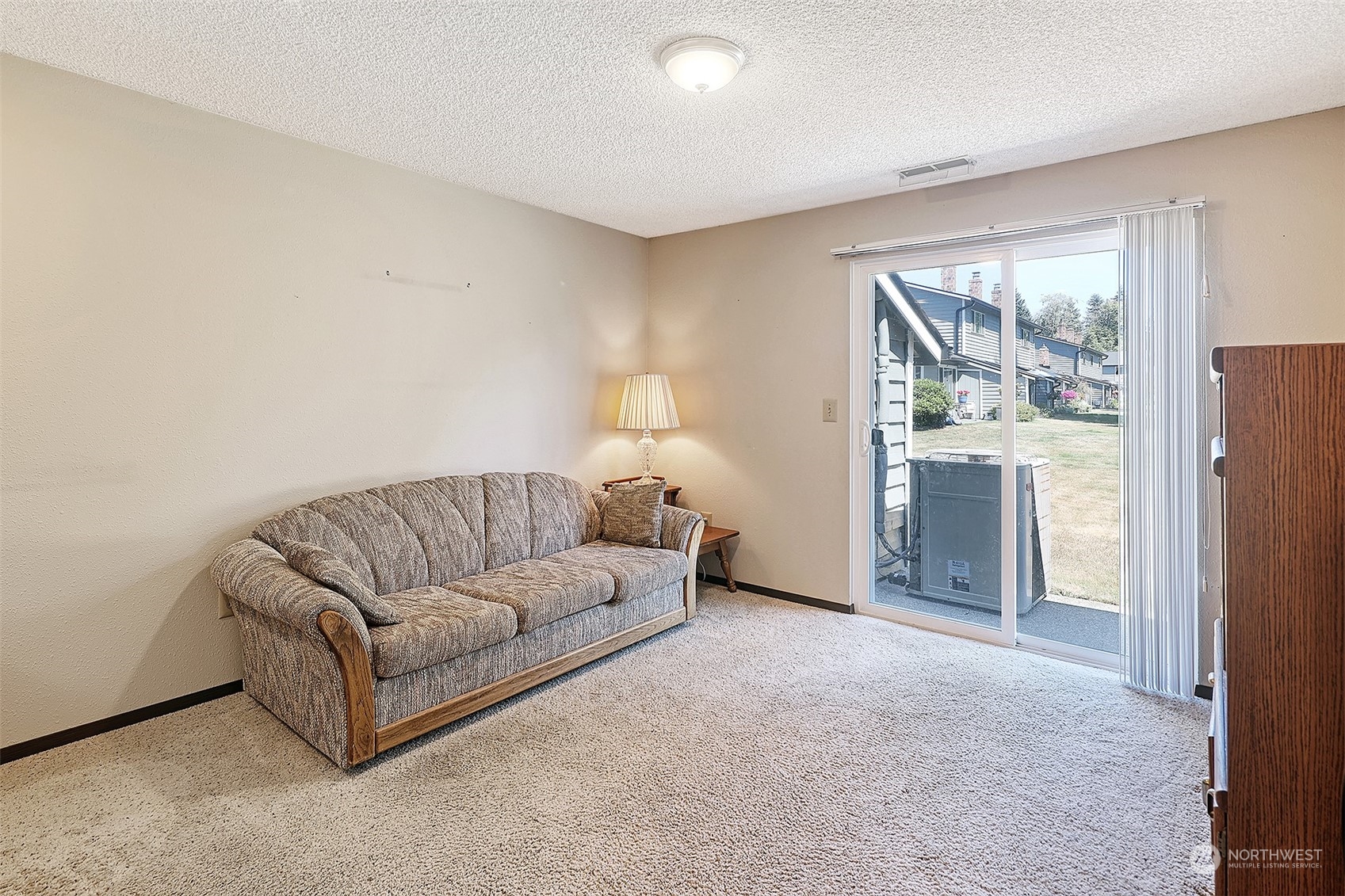 21509 4th Avenue West, Unit A21 Bothell, WA 98021 - Photo 6 of 17 a living room with furniture and a window