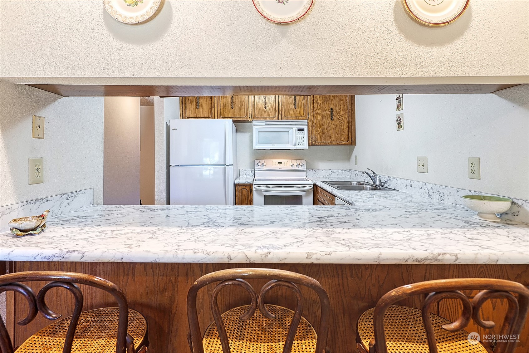21509 4th Avenue West, Unit A21 Bothell, WA 98021 - Photo 8 of 17 a bathroom with a granite countertop sink and a mirror