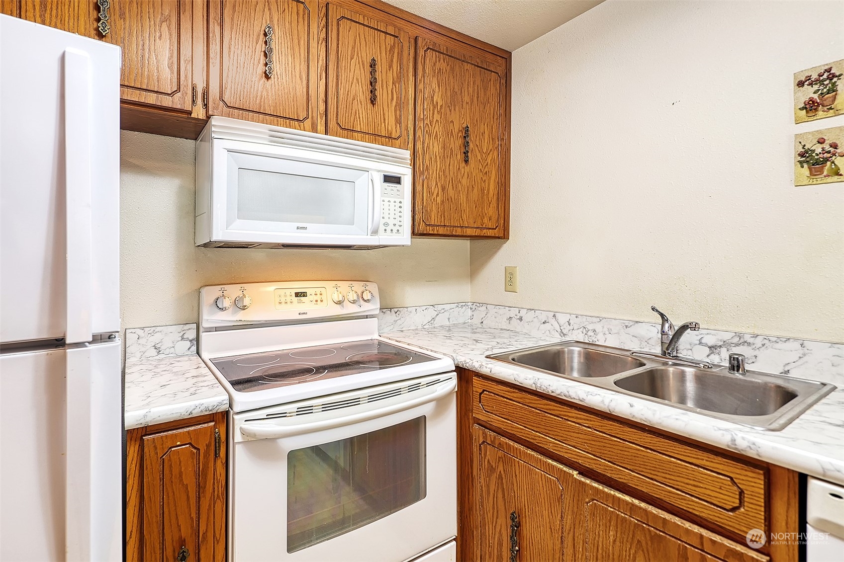 21509 4th Avenue West, Unit A21 Bothell, WA 98021 - Photo 10 of 17 a kitchen with a sink cabinets and appliances