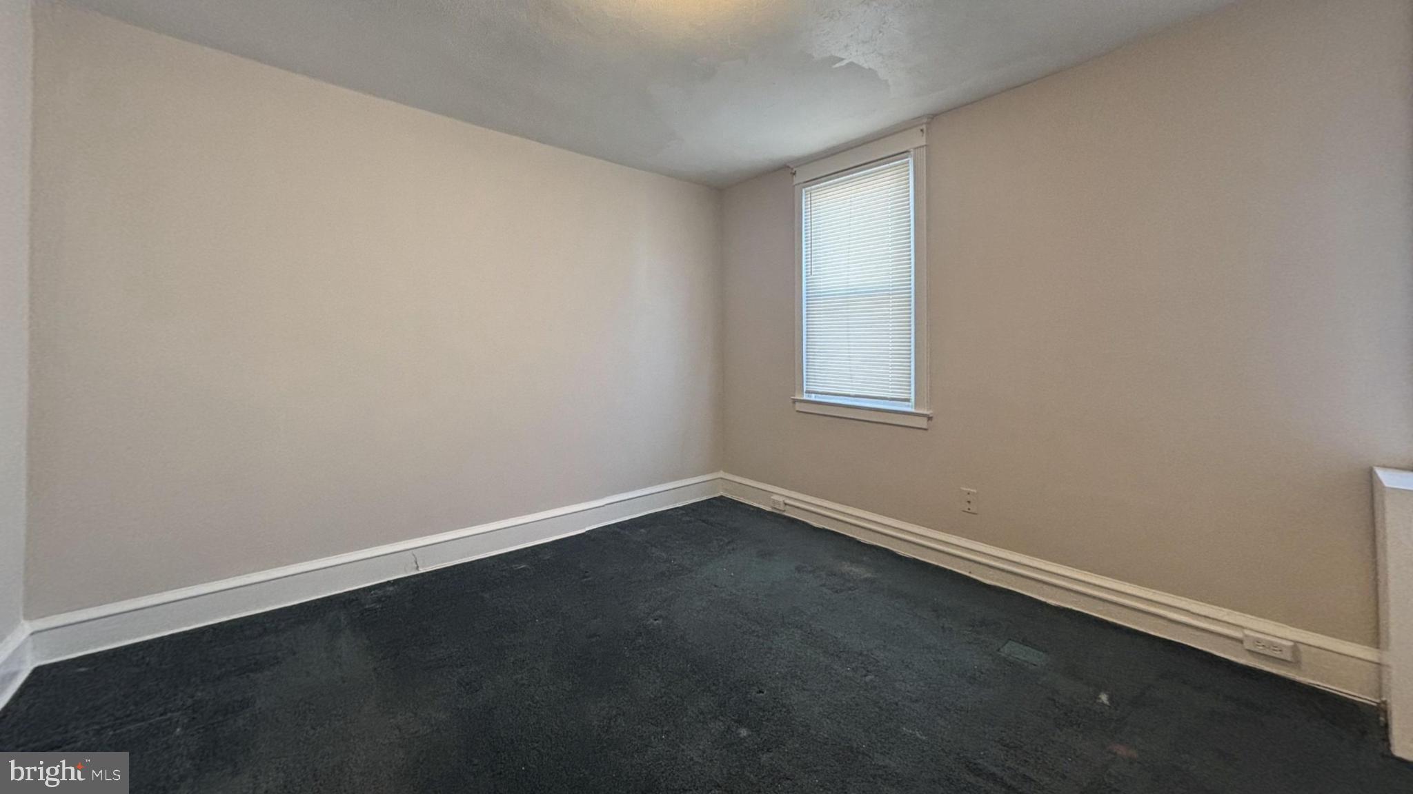 644 Littlecroft Road Upper Darby, PA 19082 - Photo 4 of 7 an empty room with a window
