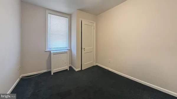 an empty room with a door
