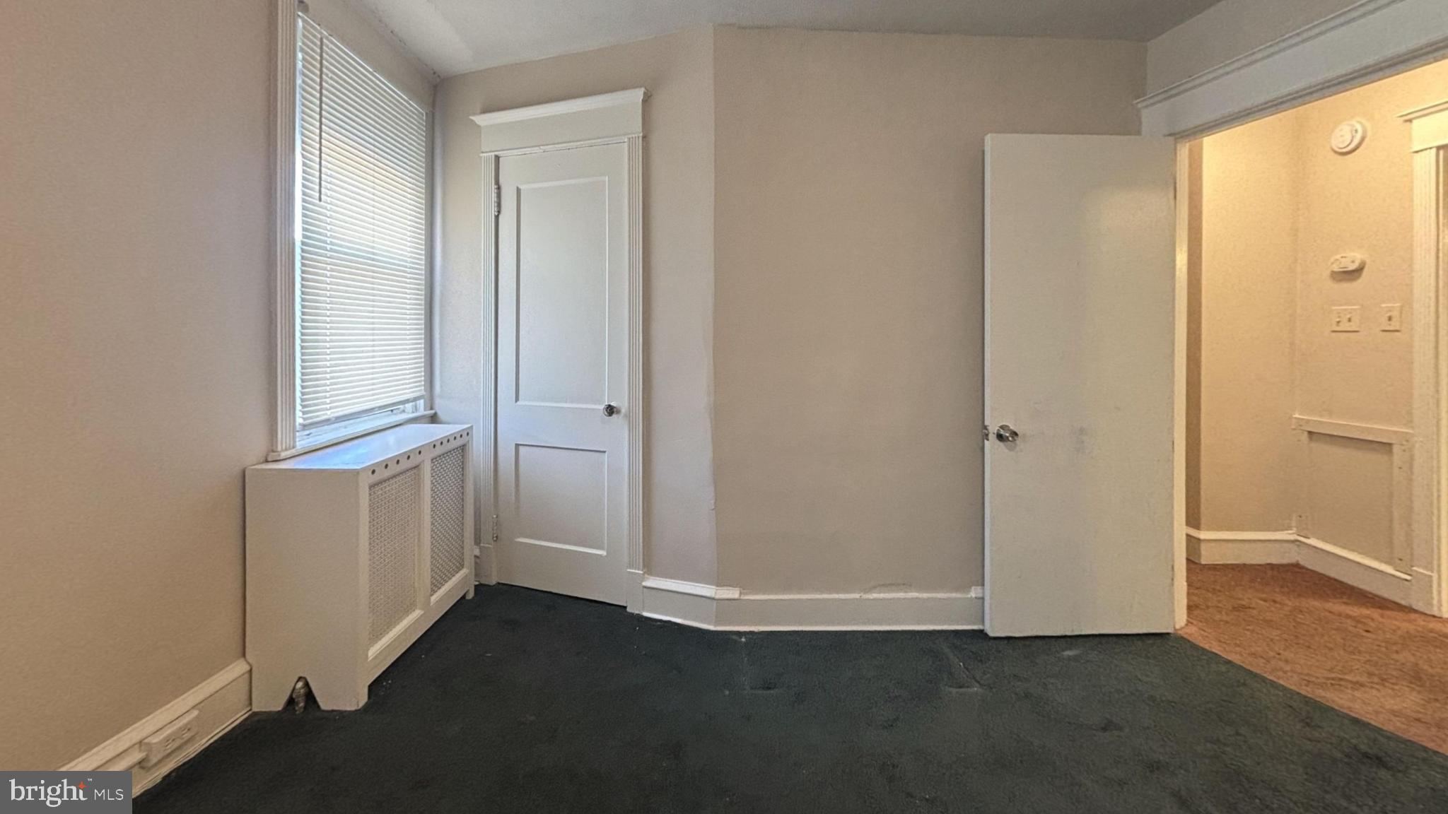 644 Littlecroft Road Upper Darby, PA 19082 - Photo 7 of 7 a view of an empty room with closet and windows