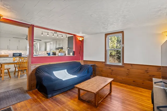 a kitchen with stainless steel appliances kitchen island granite countertop a sink and cabinets