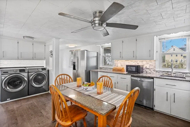 a view of a hallway with washer and dryer