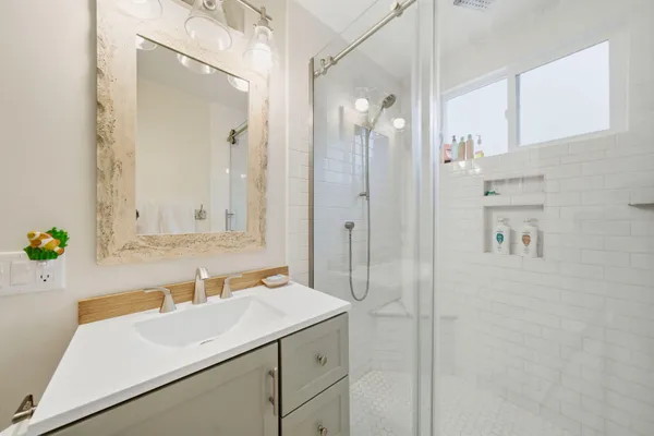 a bathroom with a sink and a mirror