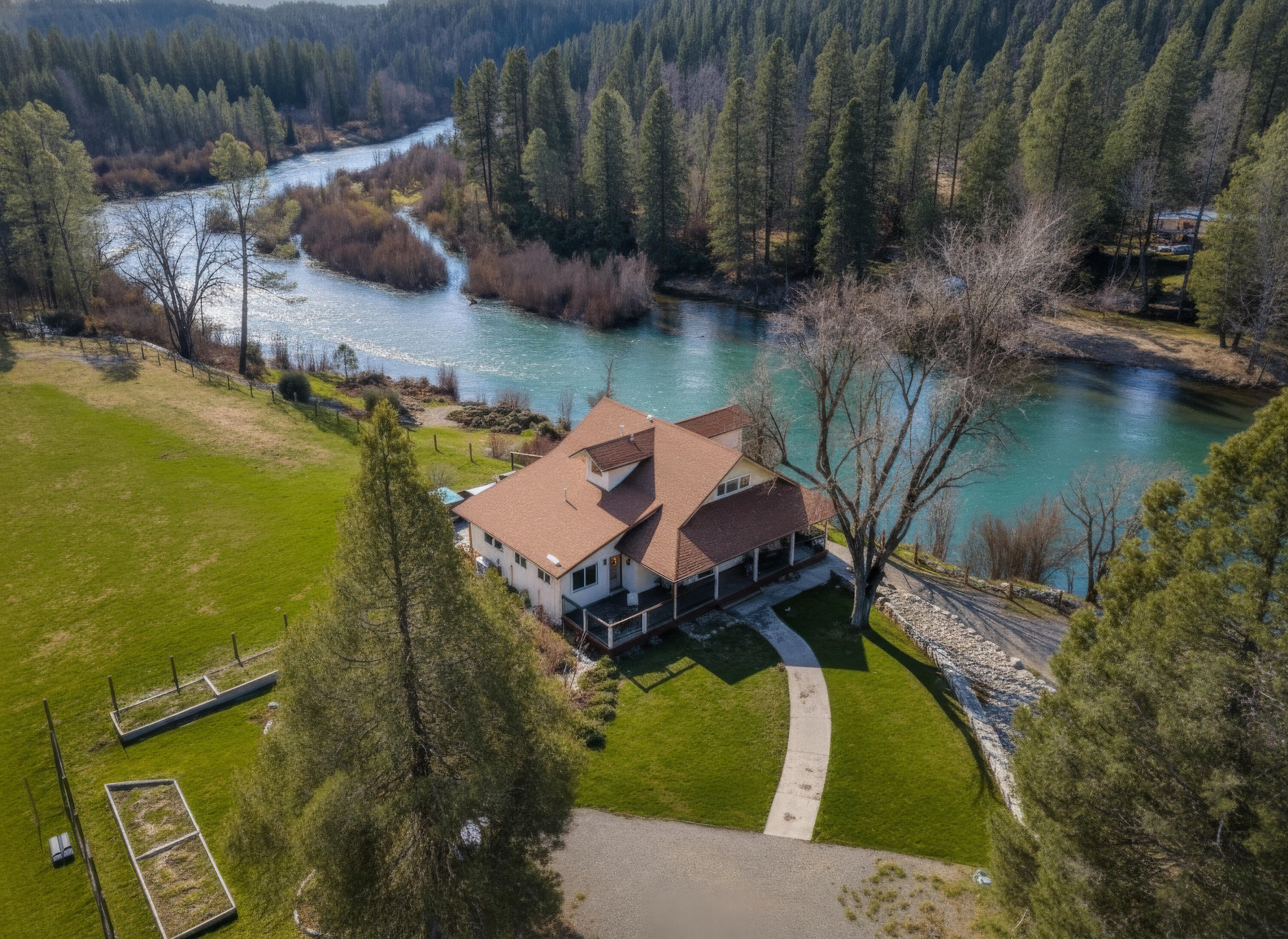 7848 Rush Creek Road Lewiston, CA 96052 - Photo 2 of 44 an aerial view of a house with outdoor space and a lake view