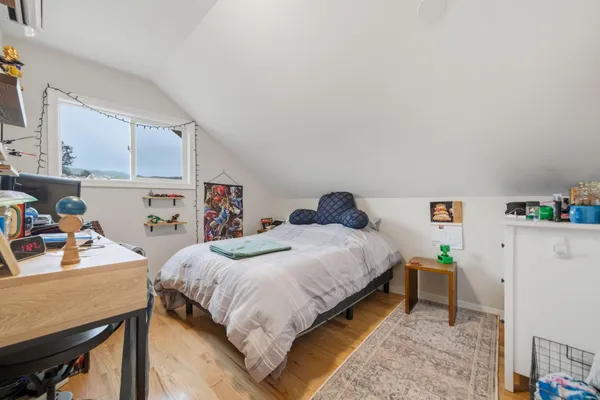 a bedroom with a bed and a table in it