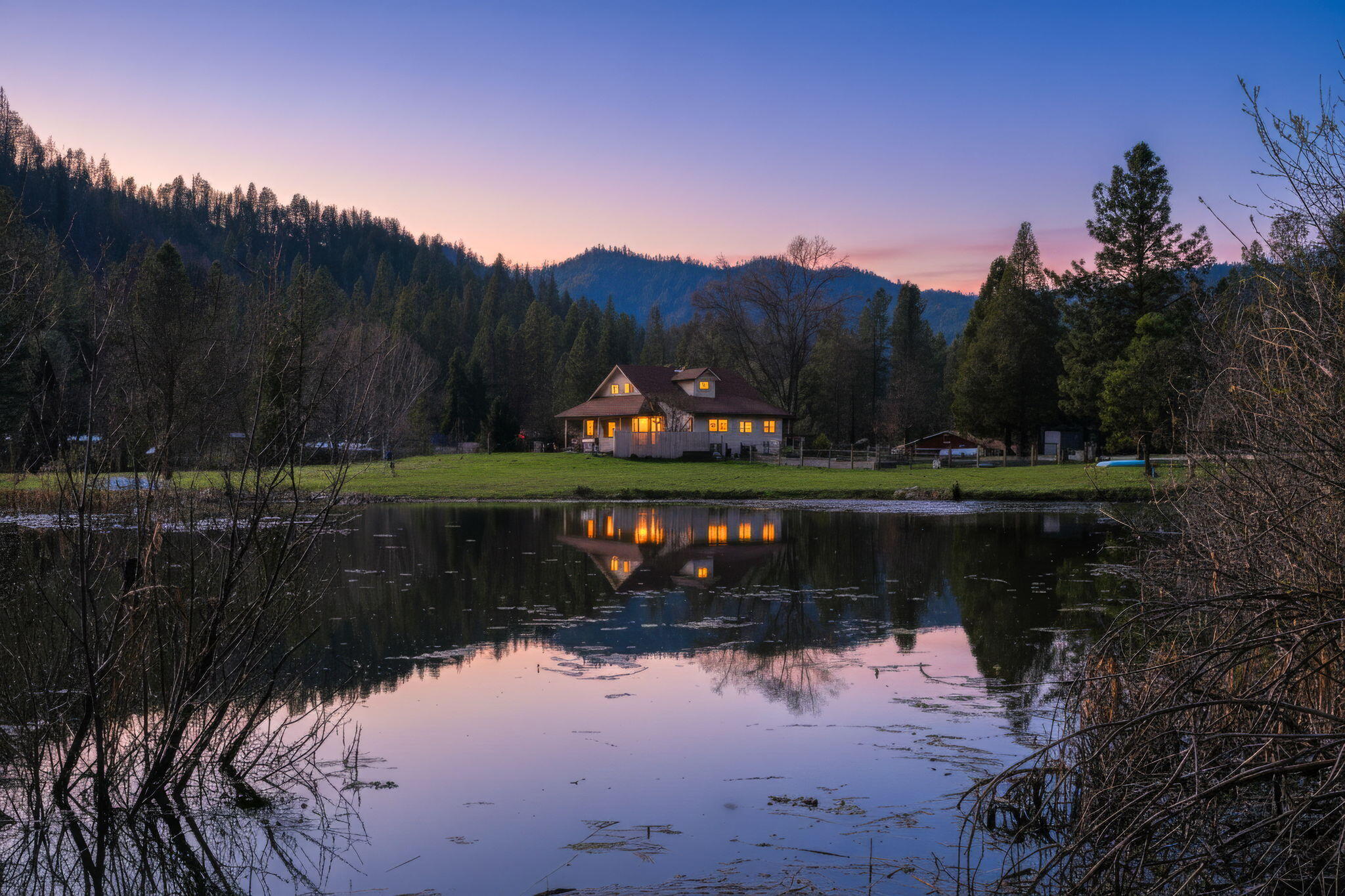 7848 Rush Creek Road Lewiston, CA 96052 - Photo 3 of 44 a view of a lake in between two of trees
