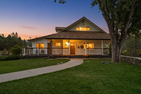 front view of a house with a yard