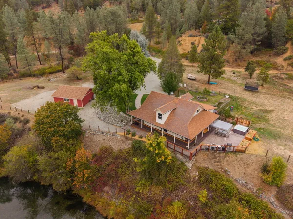 an aerial view of a house with a yard