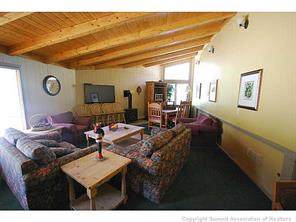 1513 East Keystone Road, Unit 2964 Keystone, CO 80435 - Photo 15 of 17 a living room with furniture and a clock