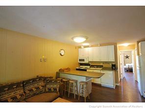 1513 East Keystone Road, Unit 2964 Keystone, CO 80435 - Photo 5 of 17 a view of kitchen island sink and wooden floor