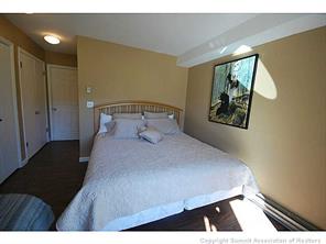 1513 East Keystone Road, Unit 2964 Keystone, CO 80435 - Photo 9 of 17 a bedroom with a bed and a painting on the wall