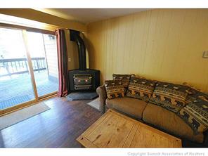 1513 East Keystone Road, Unit 2964 Keystone, CO 80435 - Photo 10 of 17 a living room with furniture and a floor to ceiling window