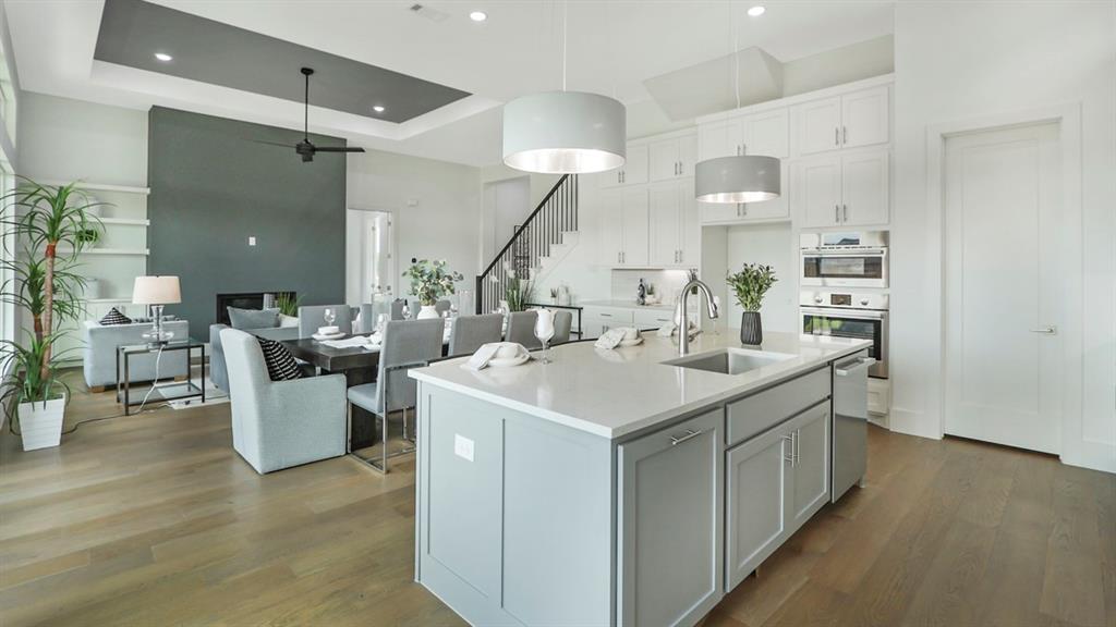 165 Lantern Ridge Drive Aledo, TX 76008 - Photo 17 of 38 a kitchen with a sink a counter top space and living room view
