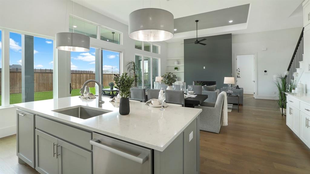 165 Lantern Ridge Drive Aledo, TX 76008 - Photo 18 of 38 a kitchen with a sink a counter space and living room