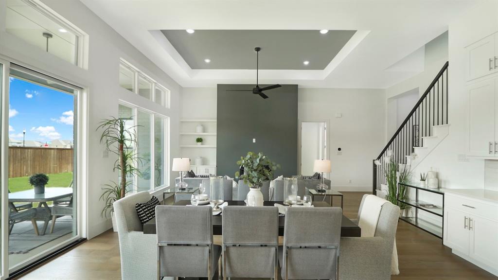 165 Lantern Ridge Drive Aledo, TX 76008 - Photo 20 of 38 a dining room with furniture a chandelier and wooden floor