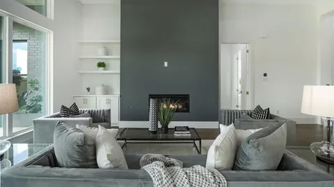 a living room with furniture and a lamp