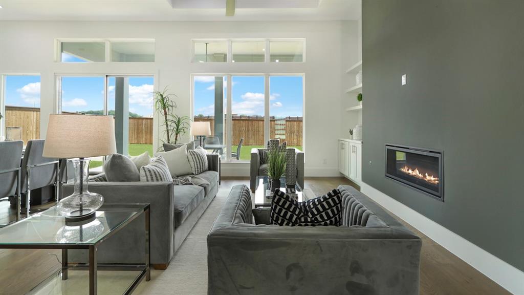 165 Lantern Ridge Drive Aledo, TX 76008 - Photo 27 of 38 a living room with furniture fireplace and a large window